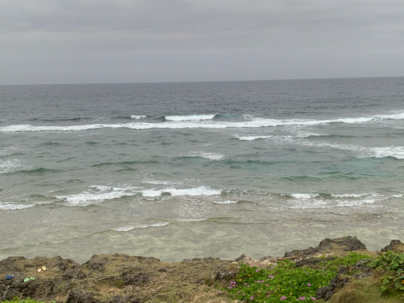 Lines of whitewater over the reef at Komesu Coast, seen from above