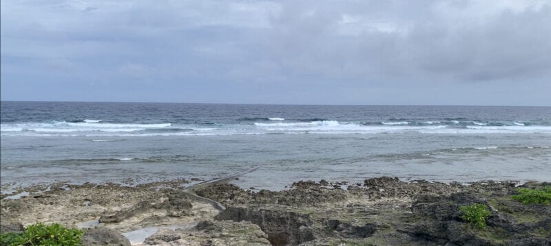 Rough gray sea over the reef at Komesu Coast